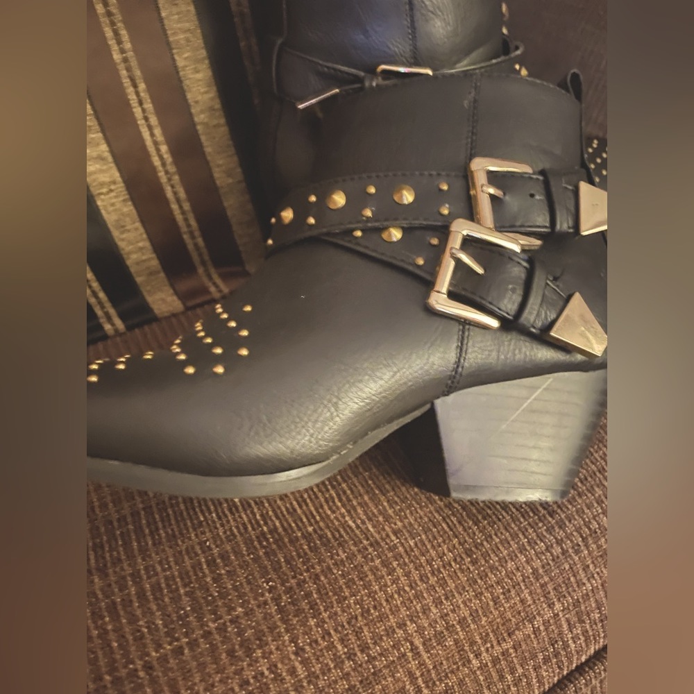 Black ankle booties with a small chunky heel